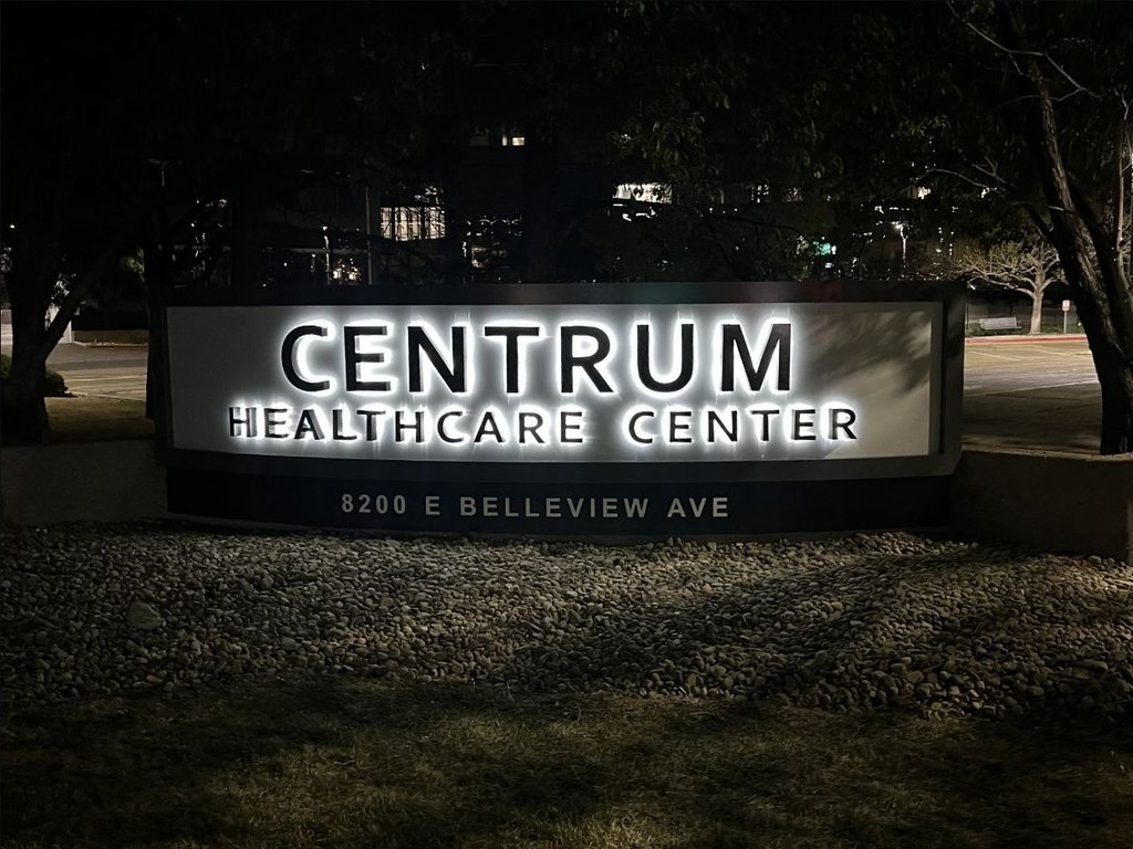 Centrum Healthcare monument sign illuminated at night