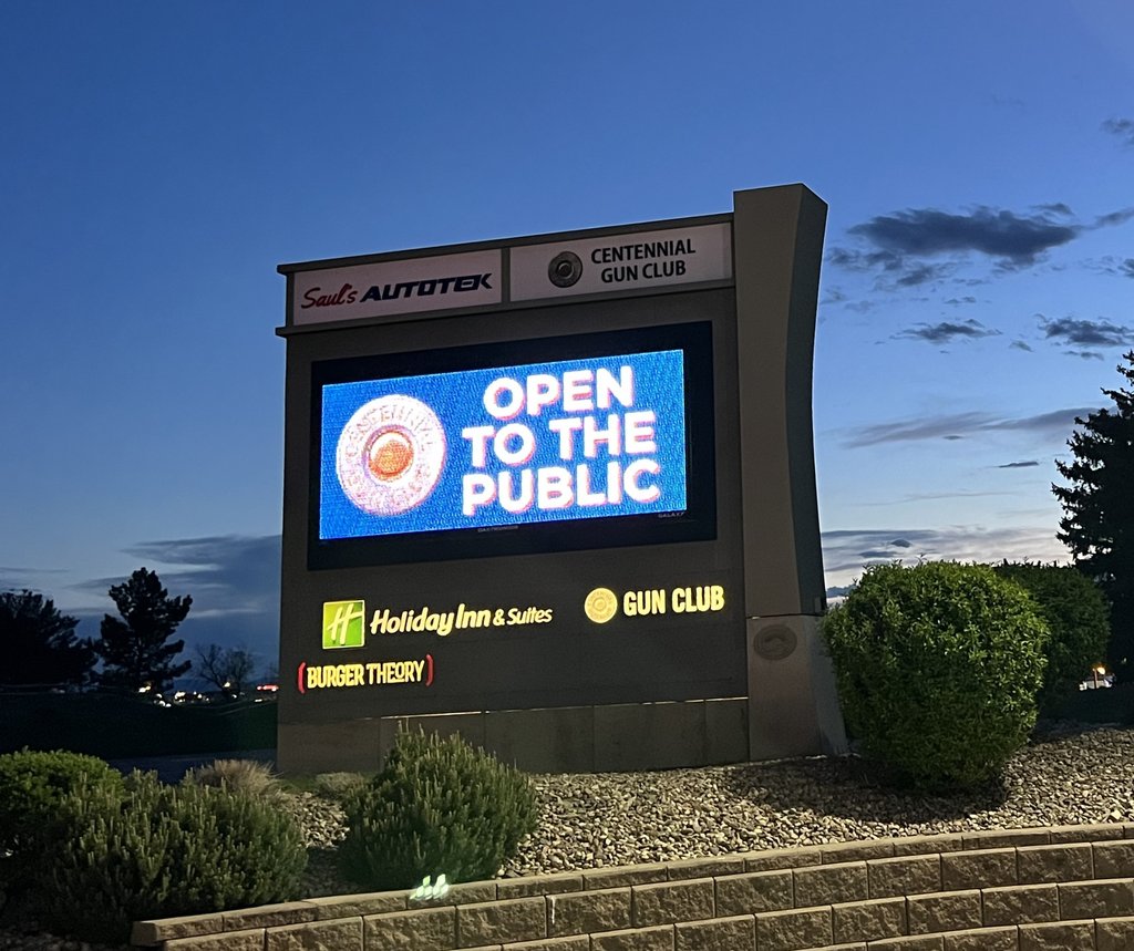 Illuminated multi-tenant monument sign with an electronic message center