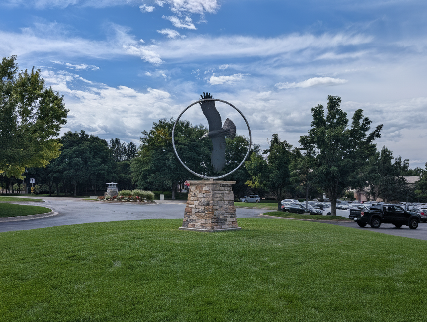 Rotating eagle sculpture on a cultured-stone pedestal at Highlands Ranch Golf Club