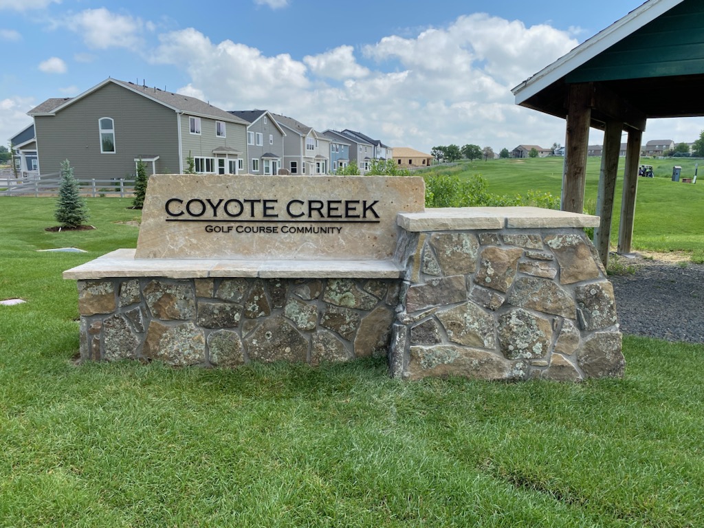 Coyote Creek Golf Course Community stone entrance monument